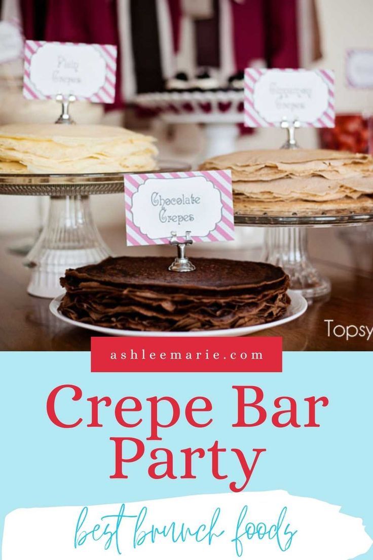 a table topped with desserts covered in crepe bar party signs and place cards