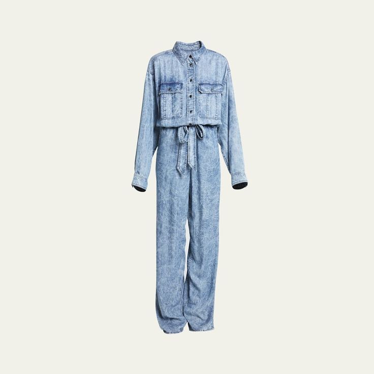 Etoile Isabel Marant "Paige" jumpsuit in light acid-wash denim  Spread collar; partial button front  Dropped shoulders Buttoned chest flap pockets Long sleeves; button cuffs Elasticized waistband with a self-tie belt  Slanted side and back patch pockets Full length  Straight legs Lyocell Lining: Cotton Dry clean Imported Belted Button-up Jumpsuit For Spring, Spring Belted Button-up Jumpsuits And Rompers, Spring Button-up Belted Jumpsuits And Rompers, Belted Button-up Jumpsuits And Rompers For Spring, Spring Denim Belted Jumpsuits And Rompers, Denim Jumpsuit With Belt Loops For Workwear In Spring, Casual Denim Belted Jumpsuit, Casual Denim Belted Jumpsuits And Rompers, Spring Denim Jumpsuit For Work With Belt Loops