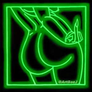 a green neon sign with an image of a horse in the middle of it's frame