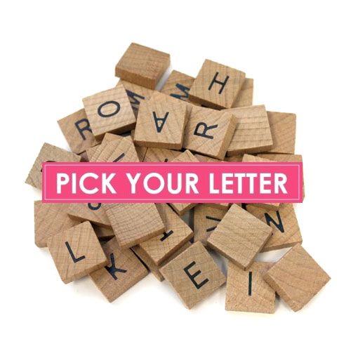 wooden scrabbles with letters spelling down the middle