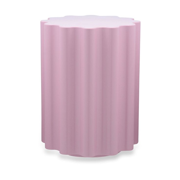 a pink vase sitting on top of a white table