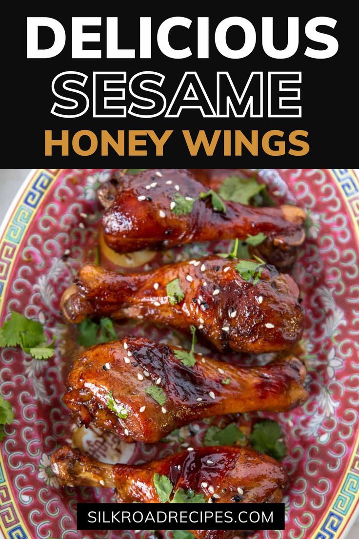 delicious sesame sesame honey wings on a plate with cilantro