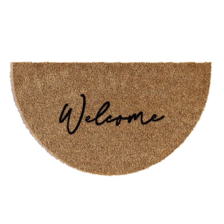 a welcome mat with the word welcome written in black ink on an oval doormat