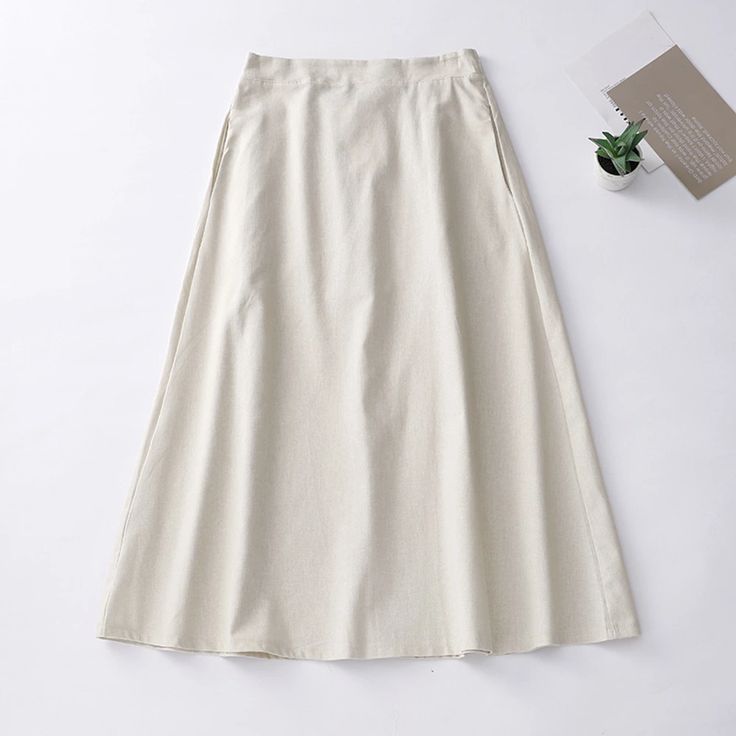 Elegant Long Skirt with Asymmetrical Bottom Casual Bottoms With Asymmetrical Hem In Solid Color, Casual Bottoms With Solid Color And Asymmetrical Hem, Casual Plain Maxi Skirt For Spring, Non-stretch Beige Maxi Skirt For Spring, Summer Plain Relaxed Fit Skirt, Beige Non-stretch Maxi Skirt For Spring, Asymmetrical Cotton Skirt In Beige, Solid Asymmetrical Maxi Skirt For Spring, Beige Cotton Asymmetrical Skirt