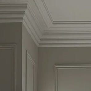 an open door in a room with white walls and molding on the trimmings