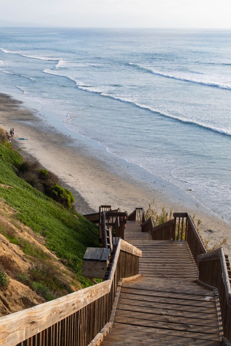 stairs lead down to the beach and ocean