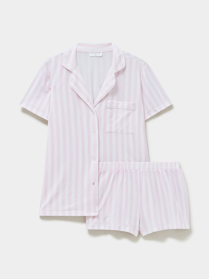 For the most luxurious night’s sleep, the Short Pyjama Set in Pale Pink Stripe print is the ultimate choice. Elevating every night-time ritual, slow Sunday morning and indulgent lazy day, this is comfort like no other. Made from 95% biodegradable TENCEL™ Modal x Micro (AKA trees!). Proven to be more than twice as soft as cotton. Cloud-soft, breathable, feminine, and comfortable. Sustainable nightwear designed by women, for women. One tree planted with every order. Models wear a size M. Mainline - 95% TENCEL™ Modal, 5% Elastane. Lace: 91% Nylon, 9% Elastane. B-Edit - 74% TENCEL™ Modal, 19% SeaCell™ and 10% Roica V550. Soft Brushed Woven - 100% EcoVero Viscose from Lenzing. We recommend washing on a cool, 30 degree wash or by hand. Dry flat and avoid tumble drying. Sleeping Clothes, Pink Sleepwear, Slow Sunday, Duvet Day, Spring Inspo, Sleep Clothes, Cute Pajama Sets, Pyjama Sets, Sleep Wear