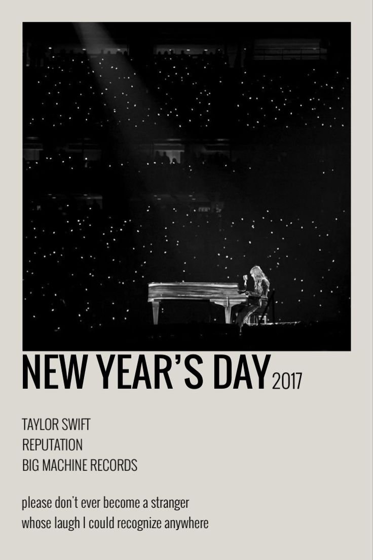 a black and white photo of a man playing a piano in front of a stage