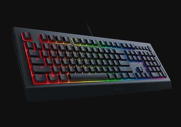 a computer keyboard with red and green lights on it's side, against a black background