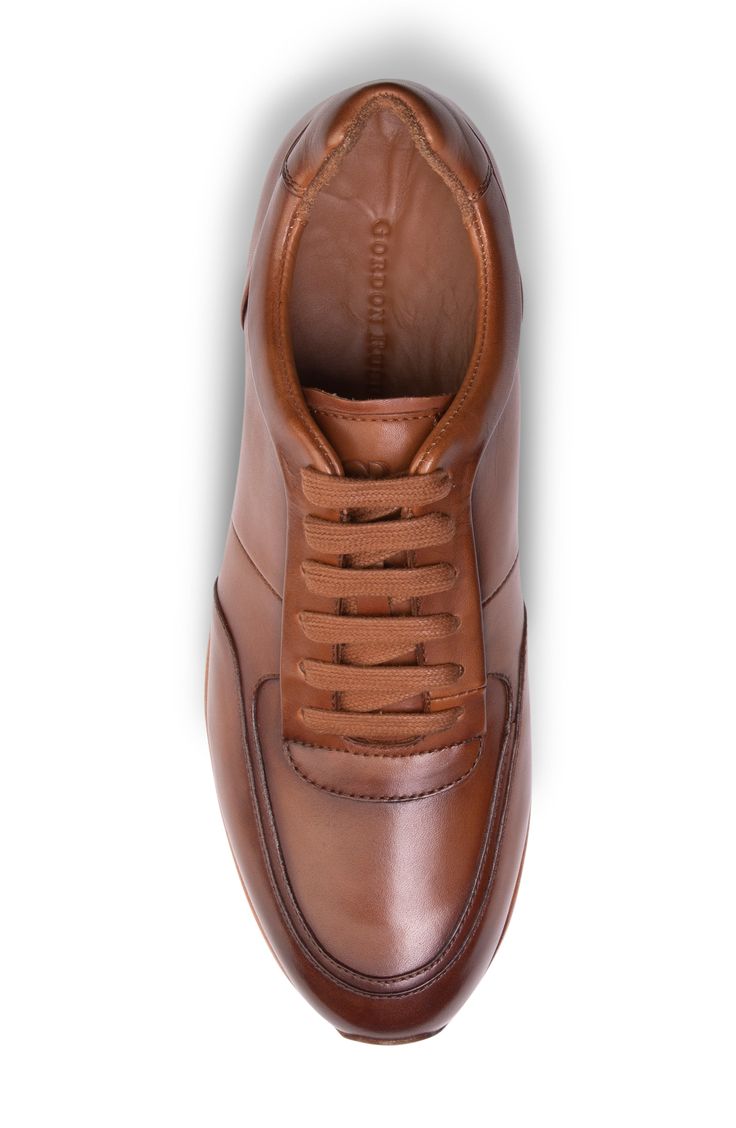 Skillful burnishing heightens the style of this Italian leather sneaker that has a breathable lining and cushy OrthoLite® technology. Removable, cushioned insole with arch support Leather upper and lining/rubber sole Imported Brown High-top Calf Leather Sneakers, Classic Brown Business Sneakers, Classic Brown Sneakers With Textured Sole, Leather Business Sneakers With Removable Insole, Business Leather Sneakers With Removable Insole, Luxury Brown Leather High-top Sneakers, Classic Lace-up High-top Sneakers With Abzorb Midsole, Classic Calf Leather High-top Sneakers, Brown Formal Sneakers With Cushioned Footbed