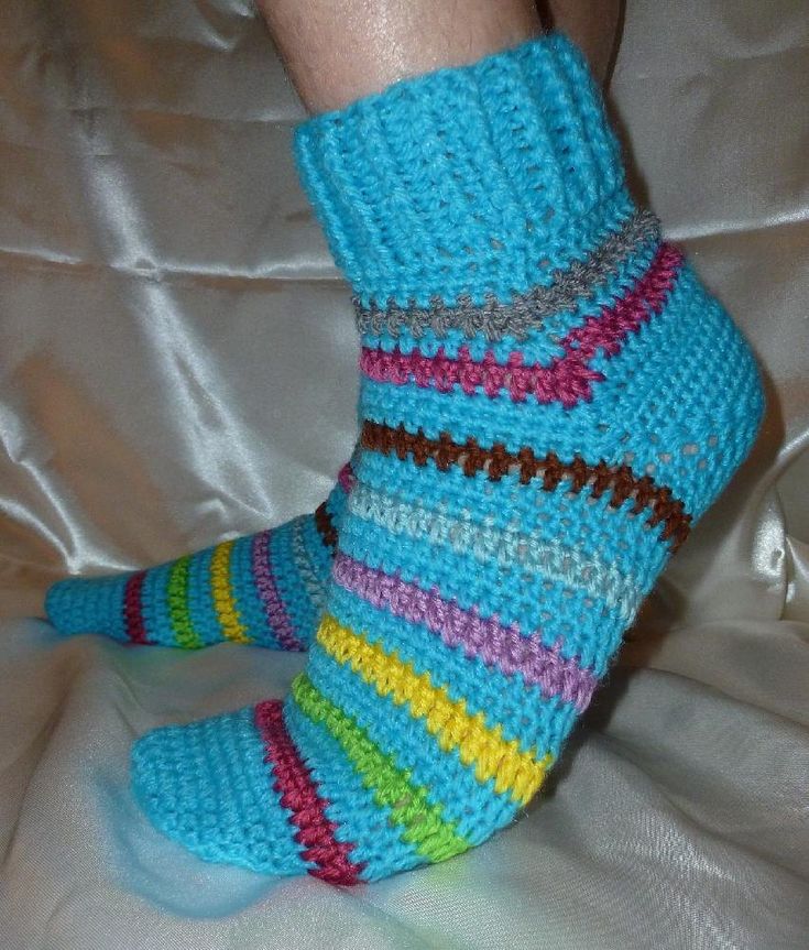 a woman's legs with colorful socks on