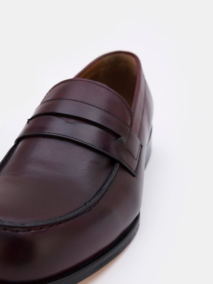 Color: bordeaux Cow leather with natural finish Penny front Leather insoles Rubber and leather soles Hand-stitched detailing Business Moccasins With Leather Sole And Round Toe, Burgundy Business Dress Shoes With Rubber Sole, Burgundy Dress Shoes With Rubber Sole For Formal Occasions, Classic Burgundy Dress Shoes With Rubber Sole, Classic Burgundy Leather Shoes For Formal Occasions, Burgundy Leather Shoes With Leather Lining For Formal Occasions, Classic Burgundy Dress Shoes With Plain Toe, Burgundy Leather Sole Dress Shoes For Business, Formal Burgundy Leather Shoes With Rubber Sole