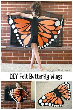 a girl in a butterfly costume standing next to a brick wall with her arms outstretched