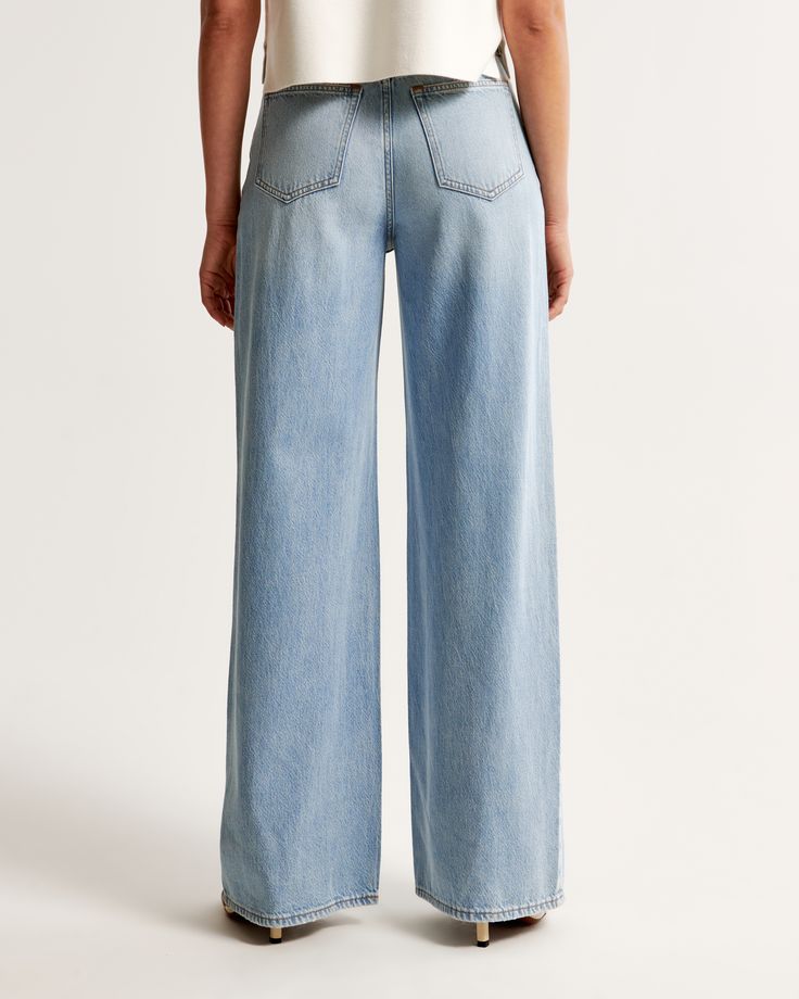 Elevate your wardrobe with the Abercrombie & Fitch Women's High Rise Wide Leg Jeans, a perfect blend of comfort and style. These jeans feature a flattering 10.5” high rise and flow into a relaxed, full-length wide leg. Crafted from a unique blend of soft, lightweight rigid denim and eco-friendly TENCEL™ Lyocell fibers, these jeans ensure both sustainability and durability.

- Size: 34 LONG
- Color: Light Wash
- Material: Cotton, TENCEL™ Lyocell
- Gender: Female
- Fit: High rise, relaxed at the w Light Wash Relaxed Fit High-waisted Bottoms, Light Wash High-waisted Relaxed Fit Bottoms, High-waisted Light Wash Relaxed Fit Bottoms, Wide-leg Light Wash Cotton Bottoms, Light Wash Relaxed Fit Wide-leg Bottoms, High Rise Wide Leg Jeans, Denim Fabric, Leg Jeans, Wide Leg Jeans