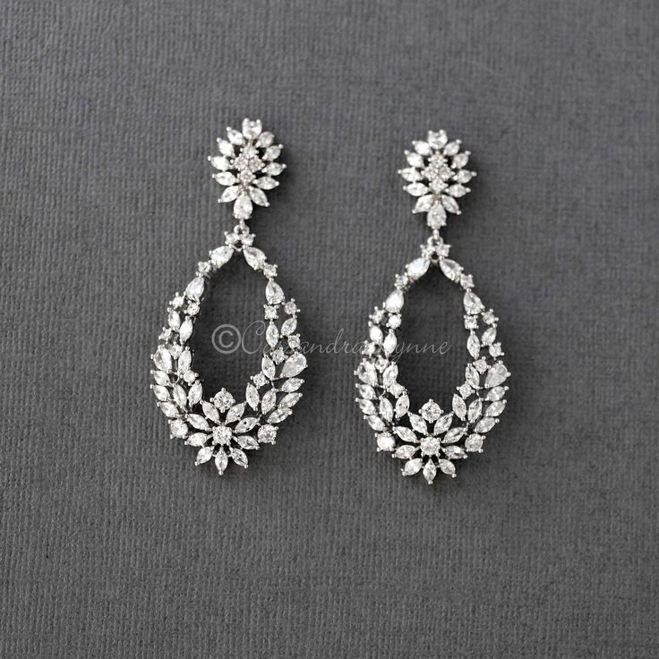 Intricately designed teardrop shaped earrings created with marquise, pear and round CZ jewels. A stunning choice for any special occasion! They are 2.25 inches long, rhodium or rose gold plated, grade AAA CZ, lead and nickel free. Infinite Money, Long Diamond Earrings, Diamond Earrings Wedding, Rose Gold Bridal Earrings, Silver Bridal Earrings, Model Blouse, Diamond Mangalsutra, Diamond Necklace Designs, Bridal Earrings Drop