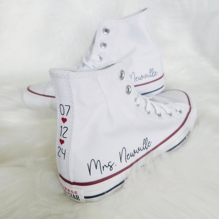 a pair of white converse shoes with the names of two people on them and hearts