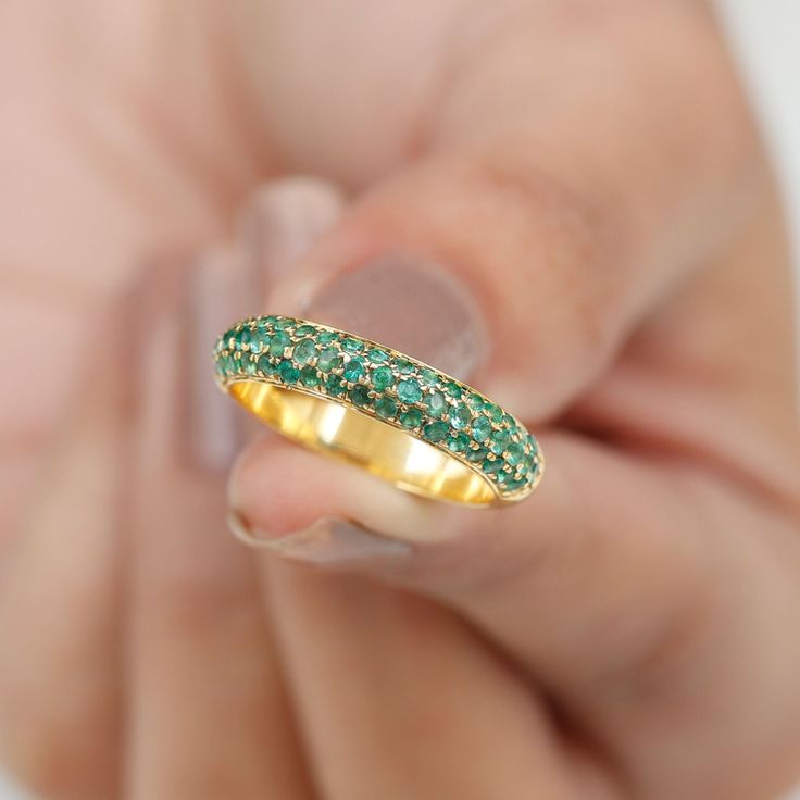 Product Details Enhance your beauty with the fine elegance of this Pave Set Emerald Band Ring. This opulent piece showcases the Emerald Stones set in a half eternity band, creating a captivating and timeless design. Embrace the distinct style this Emerald Ring offers and elevate your look with its exquisite charm. Product Information SKU SHP-RINGS0821193307 Width 1.9 mm Height 3.5 mm Weight 3.28 gm (Approximate) EMERALD INFORMATION No.of Stones 55 Pieces Total Weight 1.07 Carat (Approximate) Dimension(approx) Round-1.50X1.50 mm-36 PcsRound-1.60X1.60 mm-19 Pcs Color Green Cut Brilliant Shape Round Setting Type Pave Setting Quality Grade AAA View More Product Parent Collection Handle wedding-rings Emerald Band Ring, Emerald Band, Half Eternity Band, Eternity Band Ring, 18k Yellow Gold Ring, Pave Setting, Emerald Stone, Ring Sizer, Eternity Band