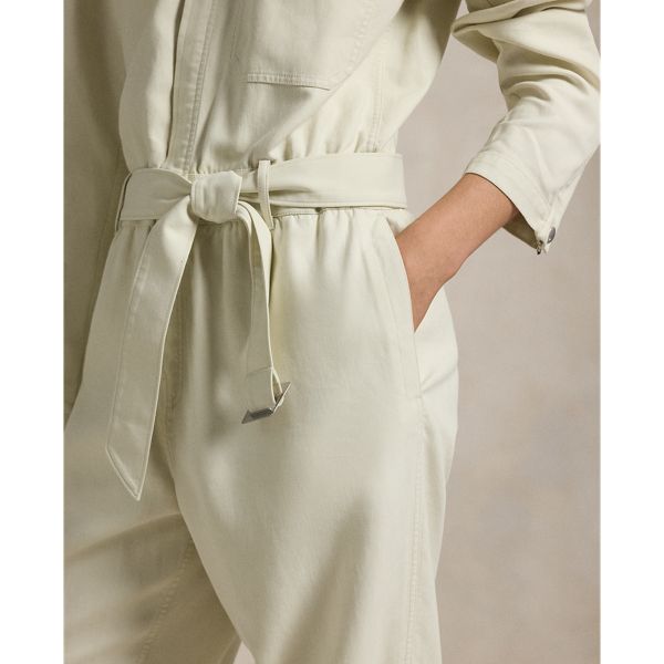 An elevation of classic utilitarian style this twill jumpsuit unites a workwear-inspired silhouette with chic design details like vented cuffs and a buckled self-belt. Chic Jumpsuits And Rompers With Belt For Workwear, Elegant Spring Jumpsuits And Rompers With Belt Loops, Workwear Jumpsuits And Rompers With Belt Loops, Chic Workwear Jumpsuits And Rompers With Belt Loops, Belted Utility Jumpsuit For Workwear, Utility Belted Jumpsuit For Workwear, Chic Workwear Jumpsuits And Rompers With Belted Cuffs, Chic Jumpsuits And Rompers With Belted Cuffs For Work, Workwear Jumpsuits And Rompers With Pockets