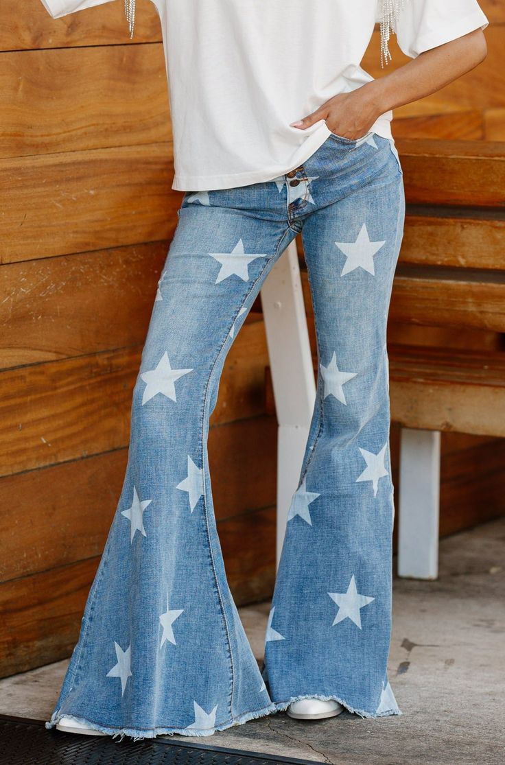 Upgrade your denim collection with the STELLA STARLIGHT DENIM JEANS. Featuring a unique denim wash and a flattering slim fit, these jeans are perfect for every occasion. Crafted from high-quality materials, they offer both style and comfort. Elevate your look with these must-have jeans. High Rise Jeans With Star Print For Spring, Trendy Straight Leg Jeans With Star Print, Trendy Star Print Bottoms For Fall, High Rise Star Print Jeans For Summer, Trendy Straight Leg Bottoms With Star Print, Straight Leg Jeans With Star Print For Spring, High Waist Star Print Jeans For Summer, Trendy Bottoms With Star Patch For Spring, Summer High Rise Jeans With Star Print