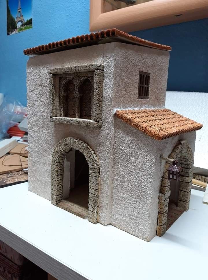 a model of a house made out of clay