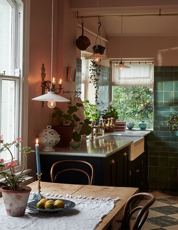 a kitchen filled with lots of counter top space next to a dining room table and chairs