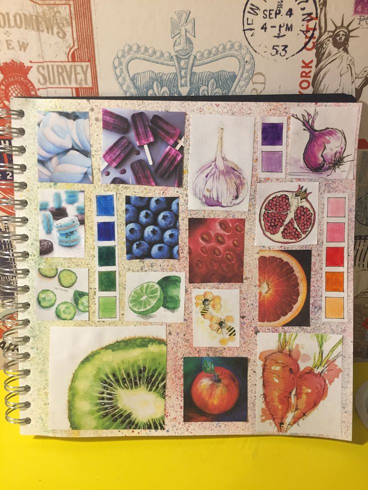 an open notebook with various pictures and fruit on it's cover, sitting on top of a yellow table