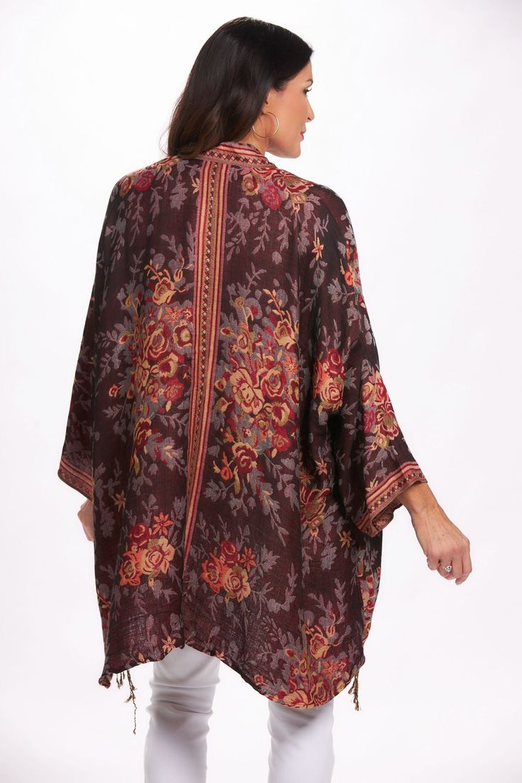 Just in time for the cooler weather! You will love the bold pattern of this printed kimono. Comfortable and cozy - right on trend this season. The tassel detail along hemline is the perfect touch. 55% Acrylic, 45% Viscose Machine Wash Cold, Hang to Dry Model is wearing the One Sized top. Model measurements: 5'9", 145lbs, 38 / 31 / 42 Luxury Bohemian Printed Kimono, London Chic, Flowy V-neck Printed Kimono, Oversized Multicolor Printed Kimono, Bohemian One-size Floral Print Kimono, Multicolor V-neck Kimono With Floral Print, Printed Kimono, Cooler Weather, Top Model