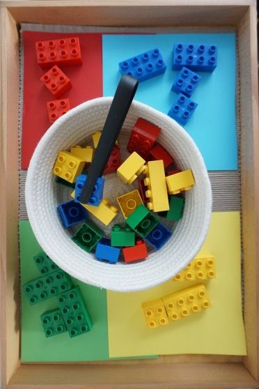 legos are in a bowl on the table