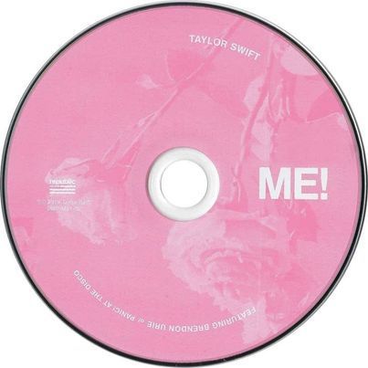 a pink cd with the word me on it