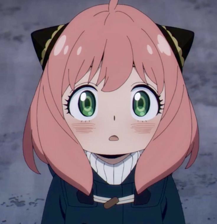 an anime character with pink hair and green eyes looks at the camera while wearing a black outfit