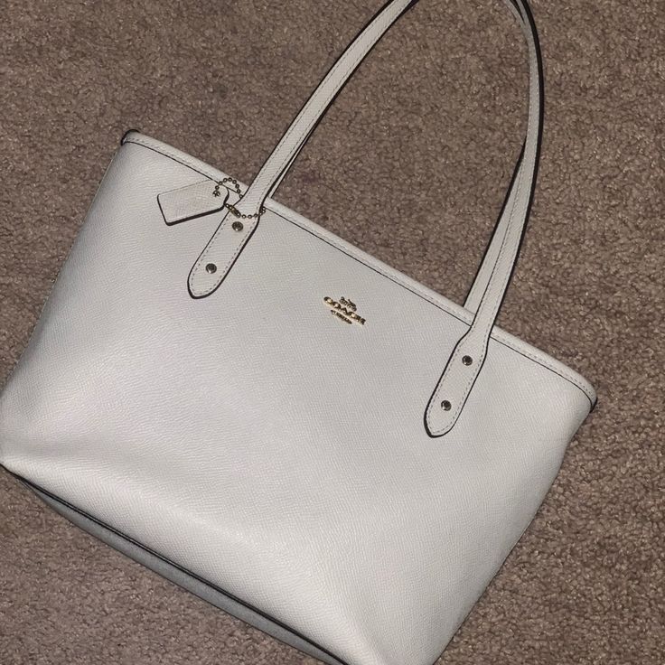 Super Cute Coach Purse! (Only Have Worn A Couple Times) -Color: White With Gold Coach Logo Open To Negotiations!! Send Me An Offer :) Coach Dempsey Tote 22 White, Coach Leather Bag, Grey Shoulder Bag, Suede Purse, Tan Handbags, Coach Tote Bags, Coach Logo, Bags Coach, Brown Leather Shoulder Bag