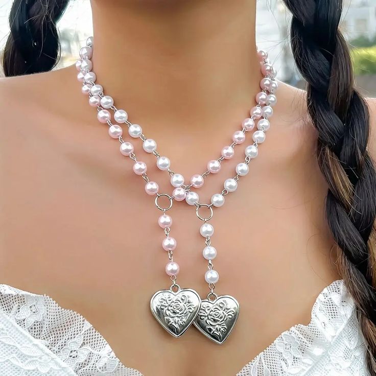 Hello, jewelry lovers! 💖✨ Discover the elegance of the Heart-Shaped Pendant Necklace, a timeless piece that adds a touch of sophistication to any outfit. This necklace features an exquisite heart-shaped pendant adorned with imitation pearls, perfect for expressing your feminine charm and style. Why You'll Love It: Charming Design: Features a heart-shaped pendant embellished with delicate imitation pearls, exuding elegance and femininity. Versatile Wear: Ideal for both casual and formal occasion Silver Heart-shaped Pearl Chain Necklace, Silver Pearl Necklace With Heart Charm, Silver Heart Necklace With Pearl Chain For Valentine's Day, Valentine's Day Metal Necklace With Pearl Chain, Valentine's Day Party Pearl Chain Necklaces, Valentine's Day Party Necklace With Pearl Chain, Valentine's Day Party Pearl Necklace, Heart-shaped Pearl Chain Jewelry For Party, Heart Shaped Pearl Chain Jewelry For Party