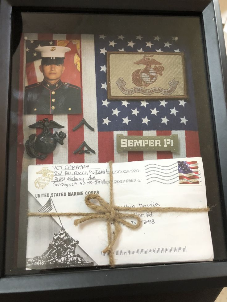 an envelope is wrapped in twine and tied up with jumbo tape, which has the us marine service insignia on it