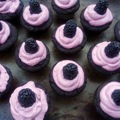 cupcakes with pink frosting and blackberries on top