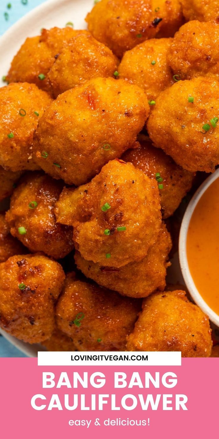 a white plate topped with fried food and dipping sauce