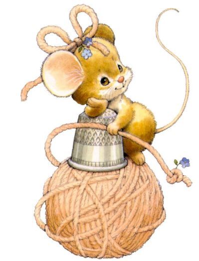 a mouse sitting on top of a ball of yarn