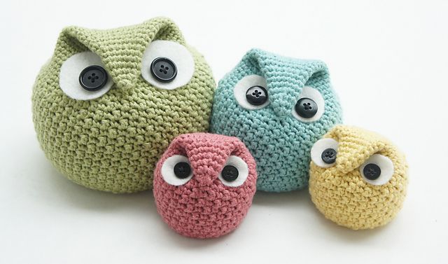 three crocheted owls sitting next to each other