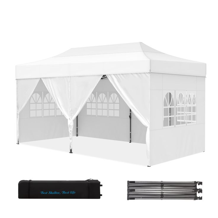 a large white tent with windows and curtains on the side, along with other accessories