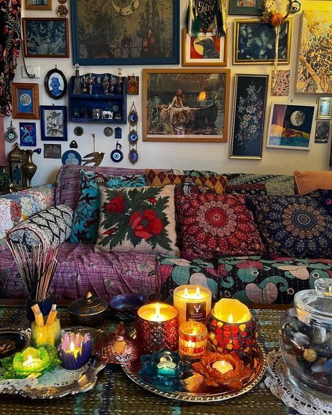 a living room filled with lots of pictures and candles