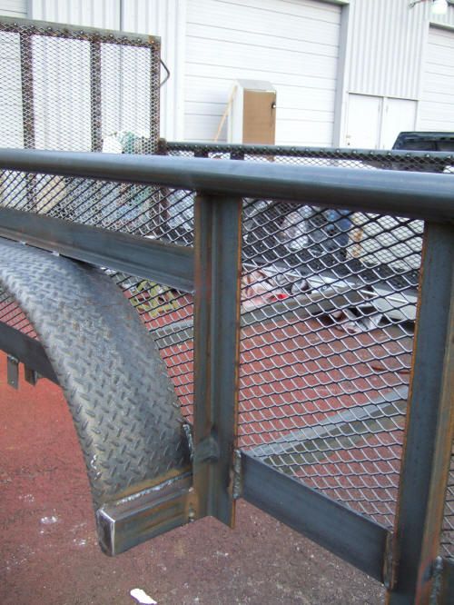 a metal gate with a tire attached to it