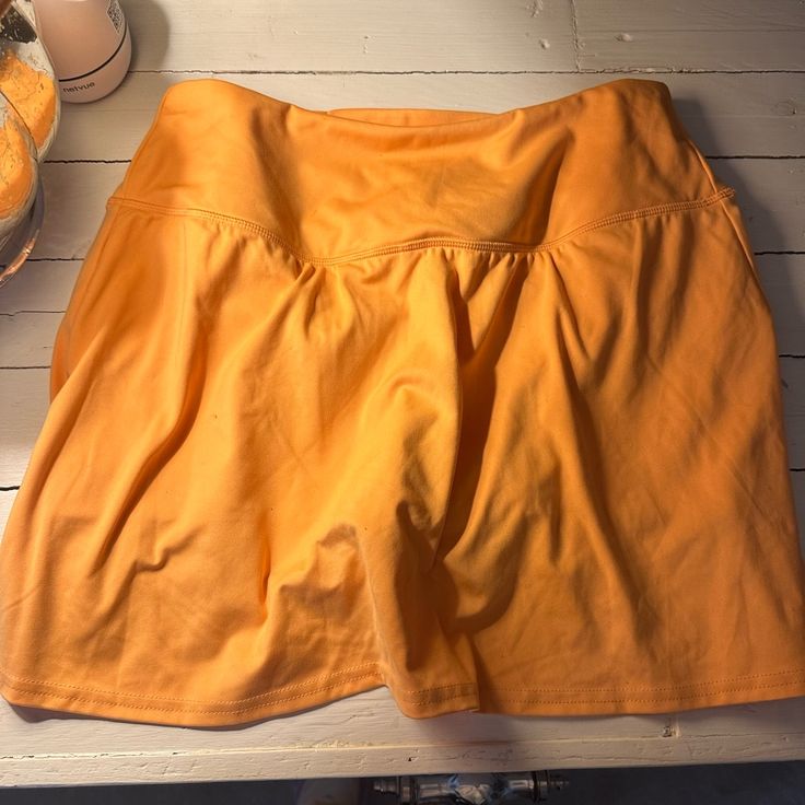 Clementine Orange Tennis Skirt, Worn Once, Practically Brand New Condition (Send An Offer) Stretch Orange Lined Skirt, Orange Stretch Lined Skirt, Orange Relaxed Mini Skirt With Lining, Orange Relaxed Fit Lined Mini Skirt, Casual Orange Stretch Skort, Orange Relaxed Mini Skirt, Relaxed Fit Orange Mini Skirt, Orange Relaxed Fit Mini Skirt, Casual Stretch Orange Mini Skirt