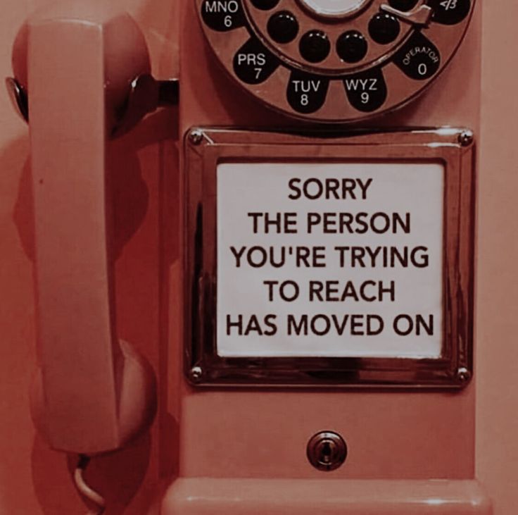 an old pink phone with a sign on it saying sorry the person you're trying to reach has moved on