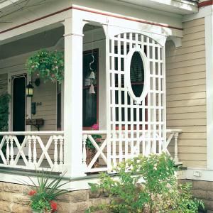 the front porch of a house with white railings