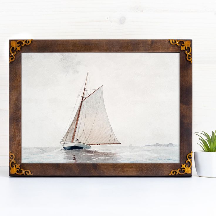 a painting of a sailboat on the water with a potted plant next to it