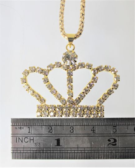 Gold or Silver Jewel Encrusted Crown Pendant, These crown necklaces are perfect for all royalty with all their rhinestones. They would make an exceptional gift for a fashionista. They are exquisite and would make an excellent charm or just as a collectible for the designer at heart. The are about 1.5 in x 2 in and they come with a 28" chain. Gold Cubic Zirconia Crystal Necklaces For Party, Costume Jewelry With Rhinestones For Gifts, Gold Cubic Zirconia Crystal Necklaces For Jewelry Making, Gold Cubic Zirconia Crystal Necklace For Jewelry Making, Jeweled Pendant Rhinestone Necklace, Jeweled Crystal Rhinestone Pendant Necklace, Crystal Rhinestone Jeweled Pendant Necklace, Gold Rhinestone Pendant Necklace For Party, Jeweled Crystal Rhinestone Necklace As Gift