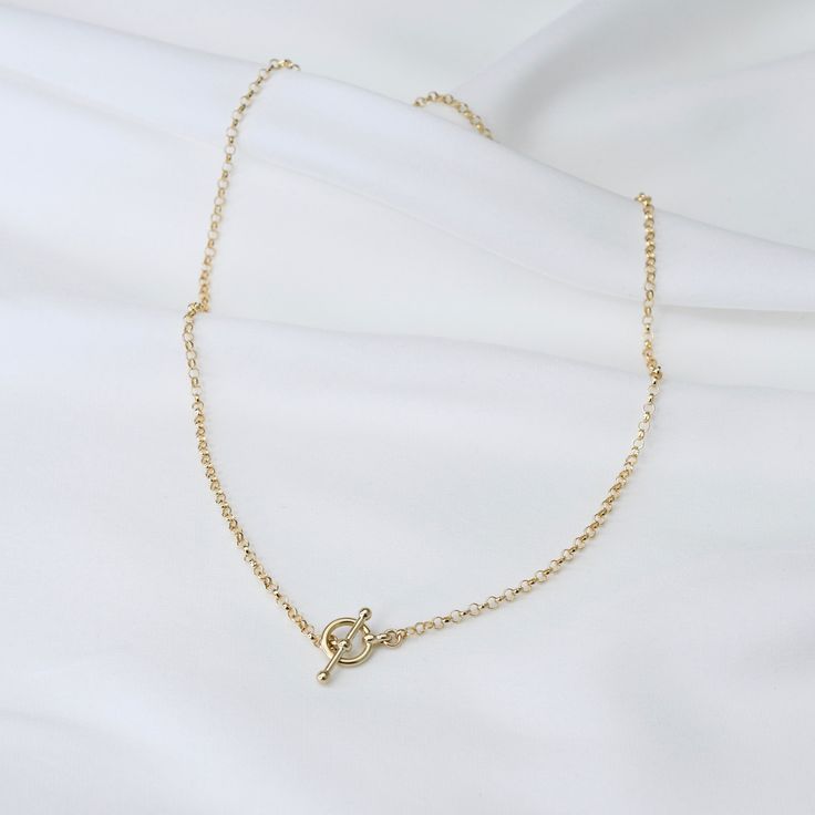 "14K Gold Toggle and Rolo chain necklace *The chain, toggle clasp and all components are 14K yellow gold (If you order a 16\" necklace, it will be a toggle clasp plus chain will be 16\".) The toggle clasp is about 12mm. 2.3mm Rolo chain Please read our policies before you place your order. https://www.etsy.com/shop/SashJewelry/policy?ref=shopinfo_policies_leftnav To see other Mother daughter necklace set click here: https://www.etsy.com/shop/SashJewelry?section_id=12441134&ref=shopsection_le Everyday Gold Lariat Necklace With Lobster Clasp, Minimalist Yellow Gold Toggle Necklace For Everyday, Minimalist Oval Link Toggle Necklace With Cable Chain, Gold Minimalist Toggle Necklace With Cable Chain, Minimalist Toggle Necklace With Oval Link Cable Chain, Everyday Gold Toggle Necklace With Cable Chain, Yellow Gold Toggle Necklace With Adjustable Chain, Classic Everyday Toggle Necklace With Adjustable Chain, Classic Yellow Gold Link Toggle Necklace