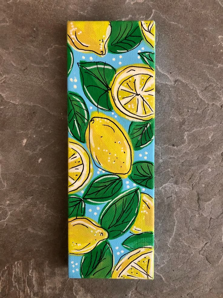 a painting of lemons and leaves on a blue background