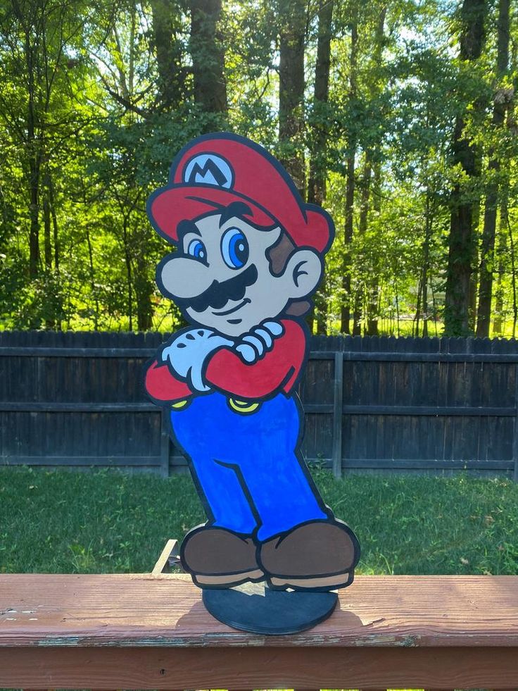 a cartoon character sitting on top of a wooden bench in the grass with trees behind it