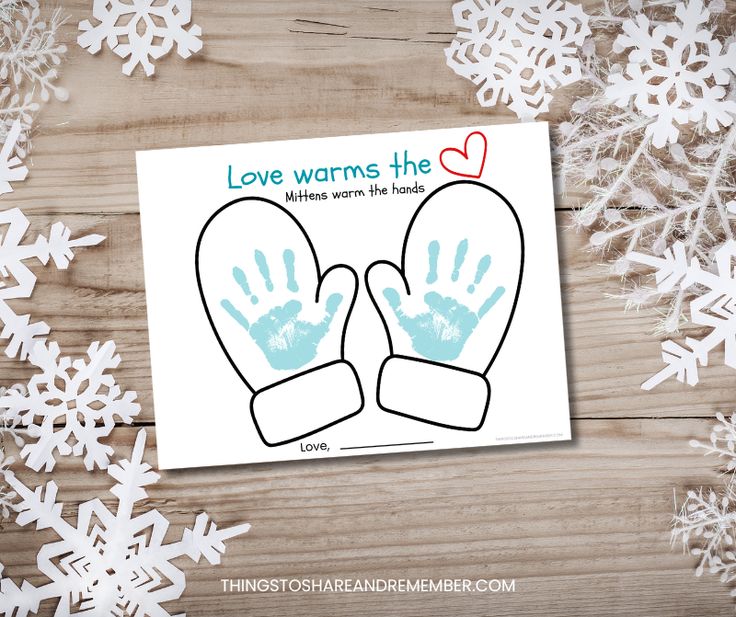 a card with two handprints on it and snowflakes in the background