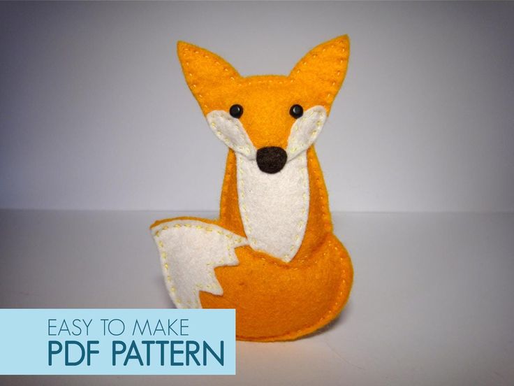 a stuffed fox sitting on top of a table next to the words easy to make pattern